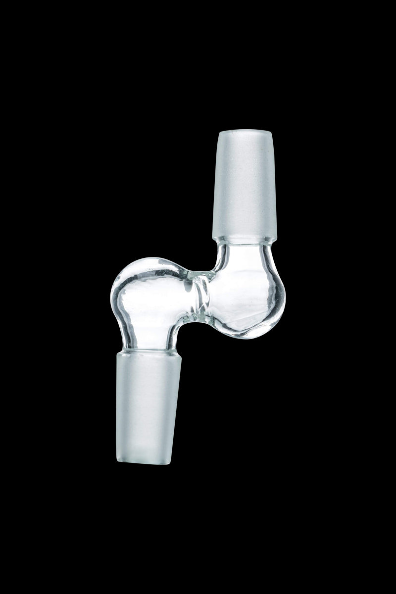 Centered close-up of a clear glass Step Up 90° Male to Male Adapter shown at a slight angle against a solid black background