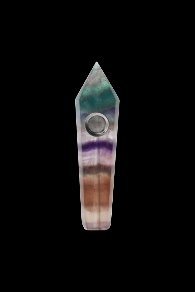 Front view of the Stone Pipe, a slender, textured pipe with a dark background emphasizing its form.