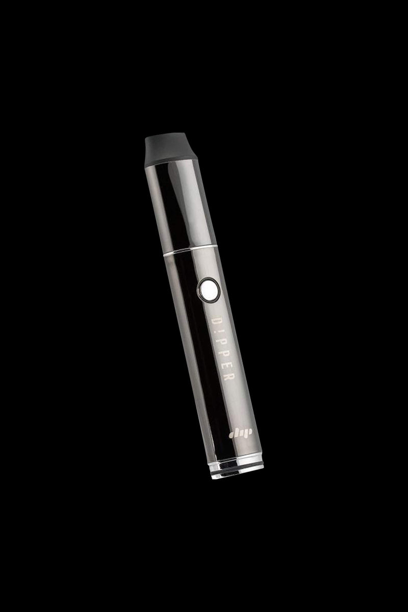 Angled close-up of a shiny black Dip Devices Vaporizer - The Dipper pen against a solid black background, the button and "DIPPER" logo visible.