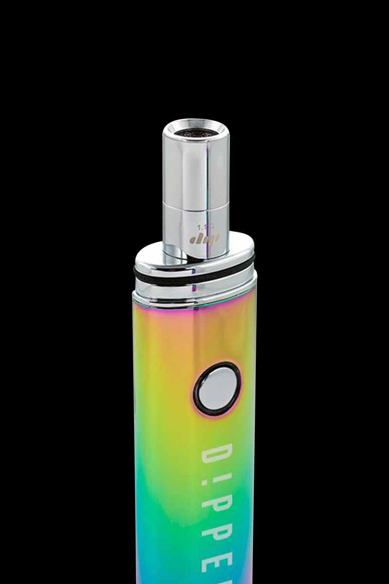Angled close-up of the Dip Devices Vaporizer - The Dipper in a reflective charcoal-finish showing its cylindrical mouthpiece, round power button, and rainbow-hued body against a black background.