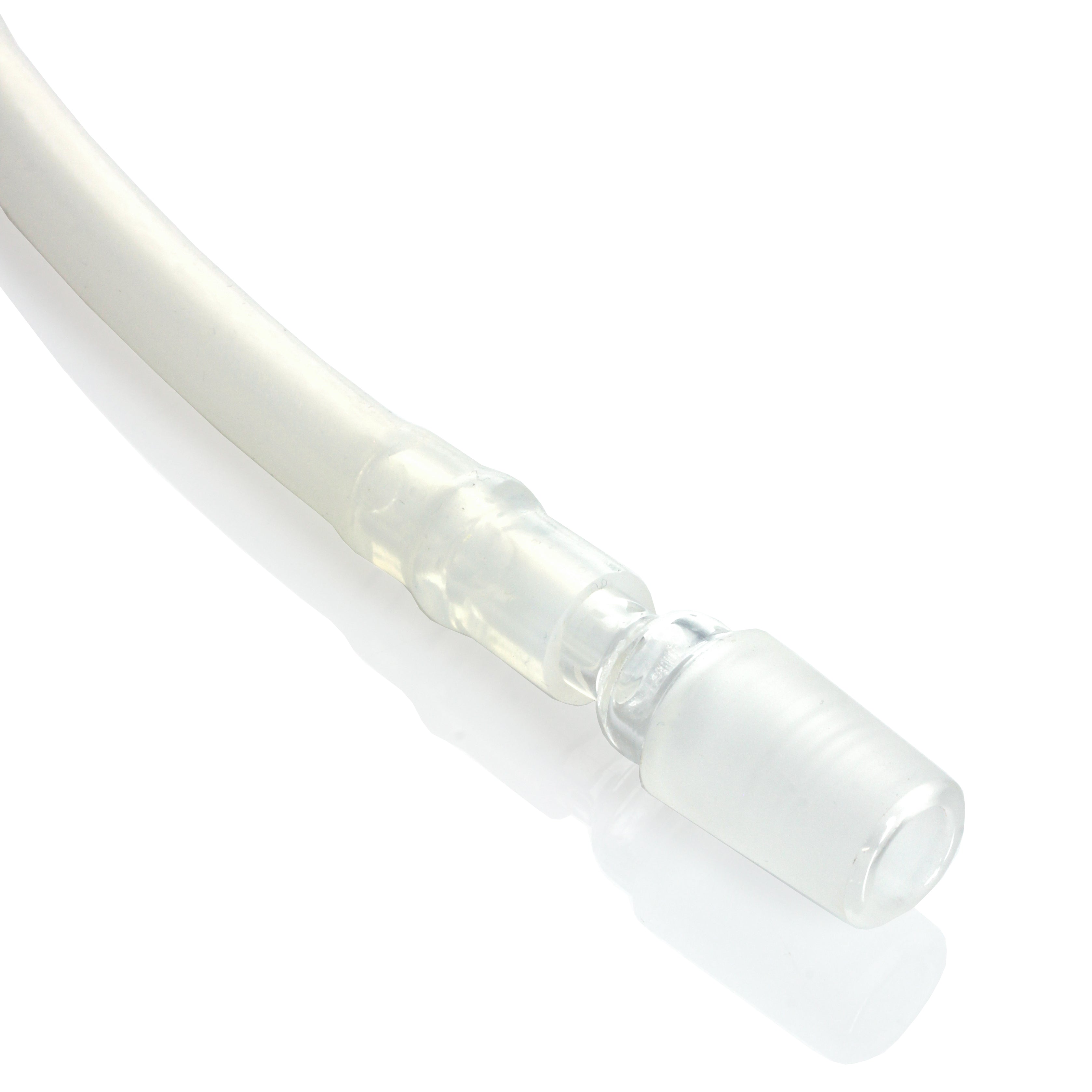 A close-up, angled view of the Dip Devices DipWhip Attachment in clear glass, reflecting light on its smooth surface.