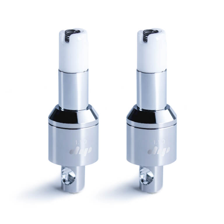 Pair of chrome Dip Devices Dipper Vapor Tip Atomizer units shown front-facing on a white background, reflections highlighting their cylindrical metal bodies and white coil-topped caps.