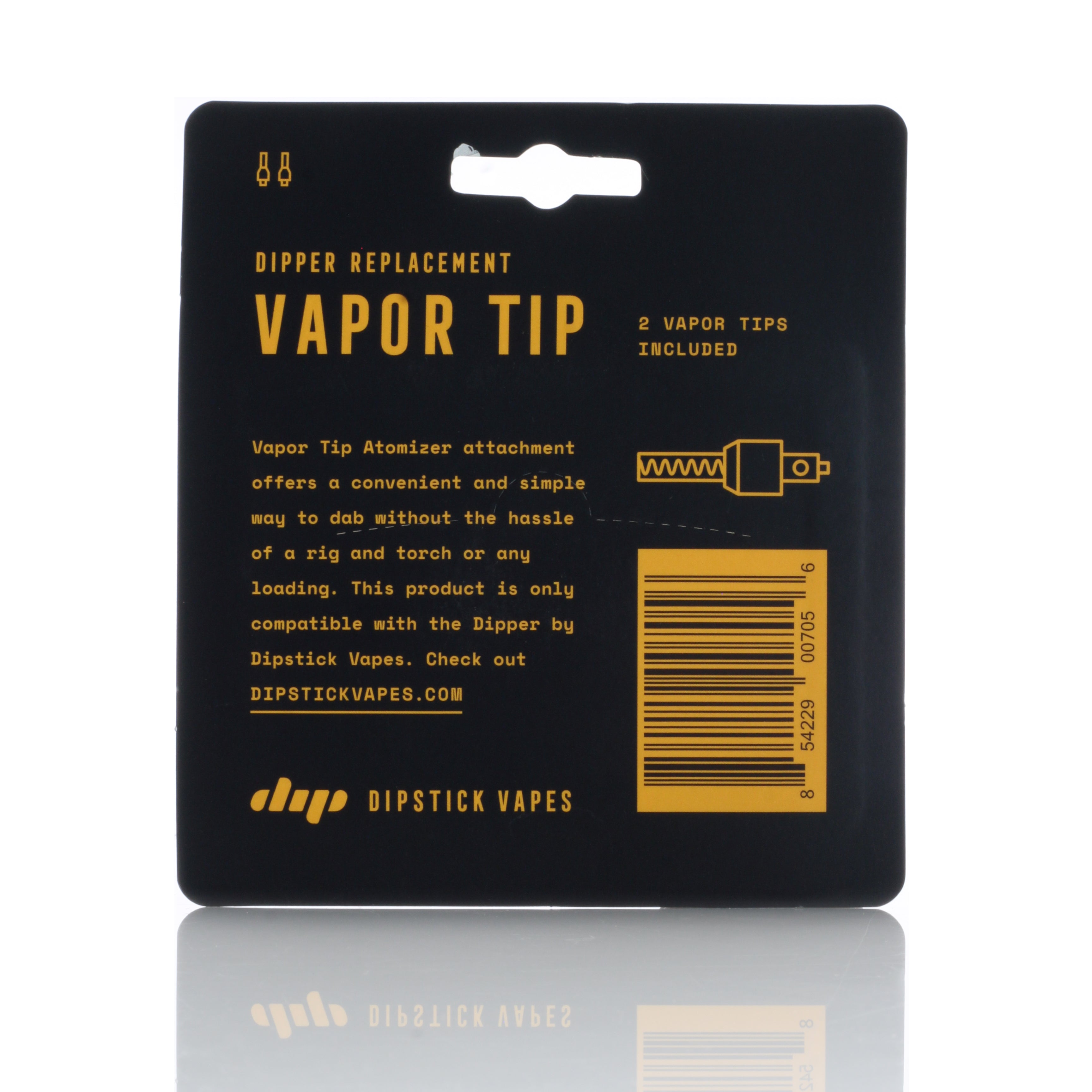 Top-down view of the black packaging with yellow text for the Dip Devices Dipper Vapor Tip Atomizer, reflected on a glossy white surface.
