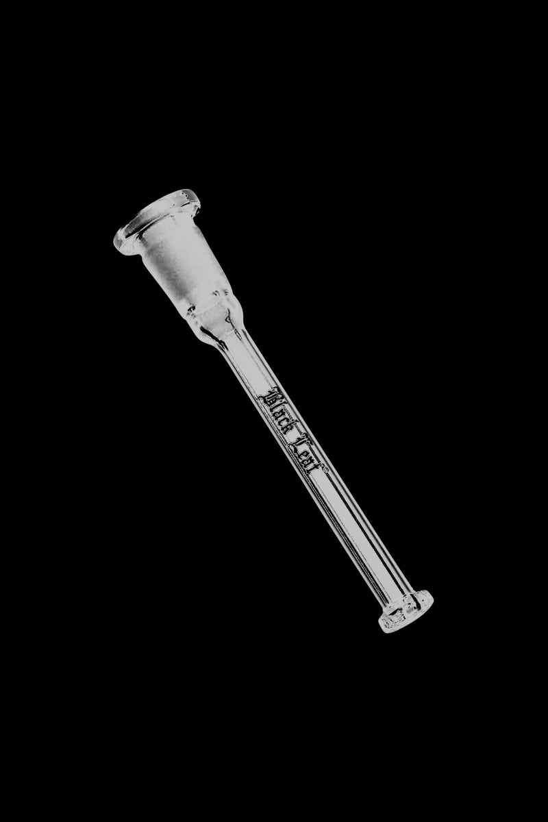 Angled close-up of the Black Leaf Inside-Cut Shower Head Perc Diffuser Downstem against a black background, showing its clear glass tube and engraved logo.