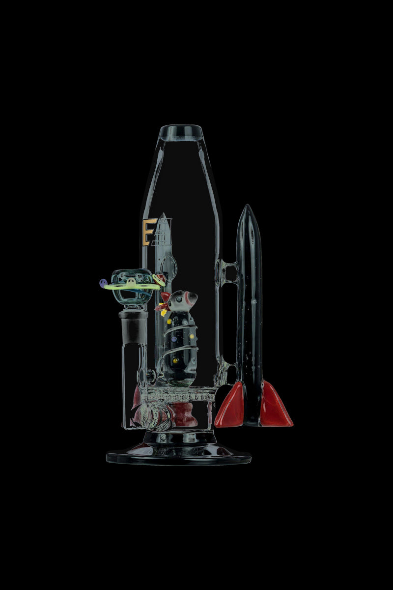 A studio shot displays the Empire Glassworks Galactic Flagship Bong, showcasing its detailed glasswork and unique, sculptural form.