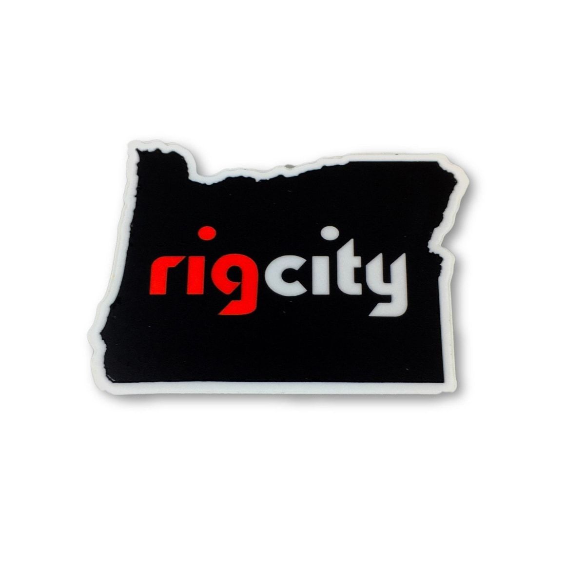 Top-down view of an ErrlyBird Rig City Sticker in the shape of Oregon with a black background, white outline, and "rigcity" logo in red and white.