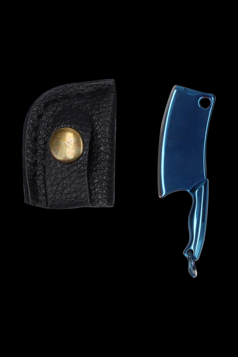Top-down view of the metallic blue THGC EX II Mini Chopping Knife with Cover next to its black leather snap cover on a black background.