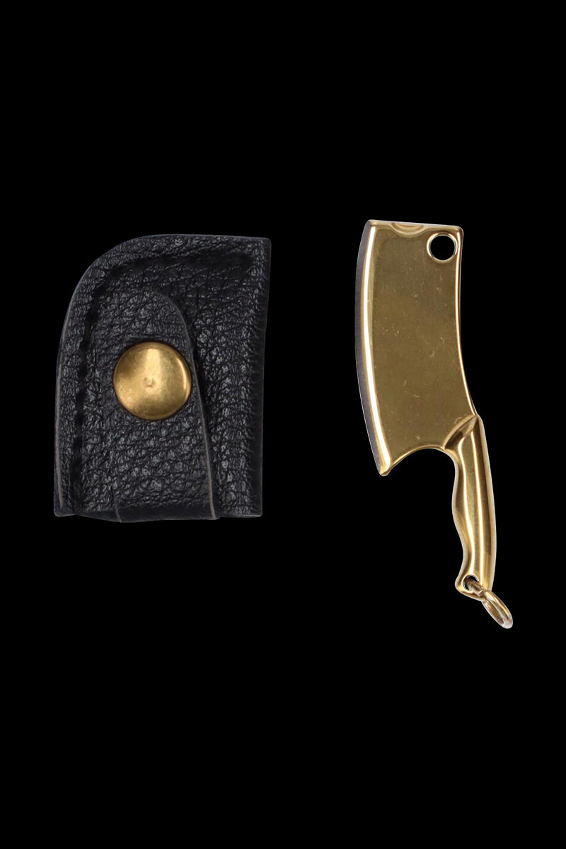 Top-down view of the THGC EX II Mini Chopping Knife with Cover showing a small gold cleaver-style knife beside a black leather snap cover.