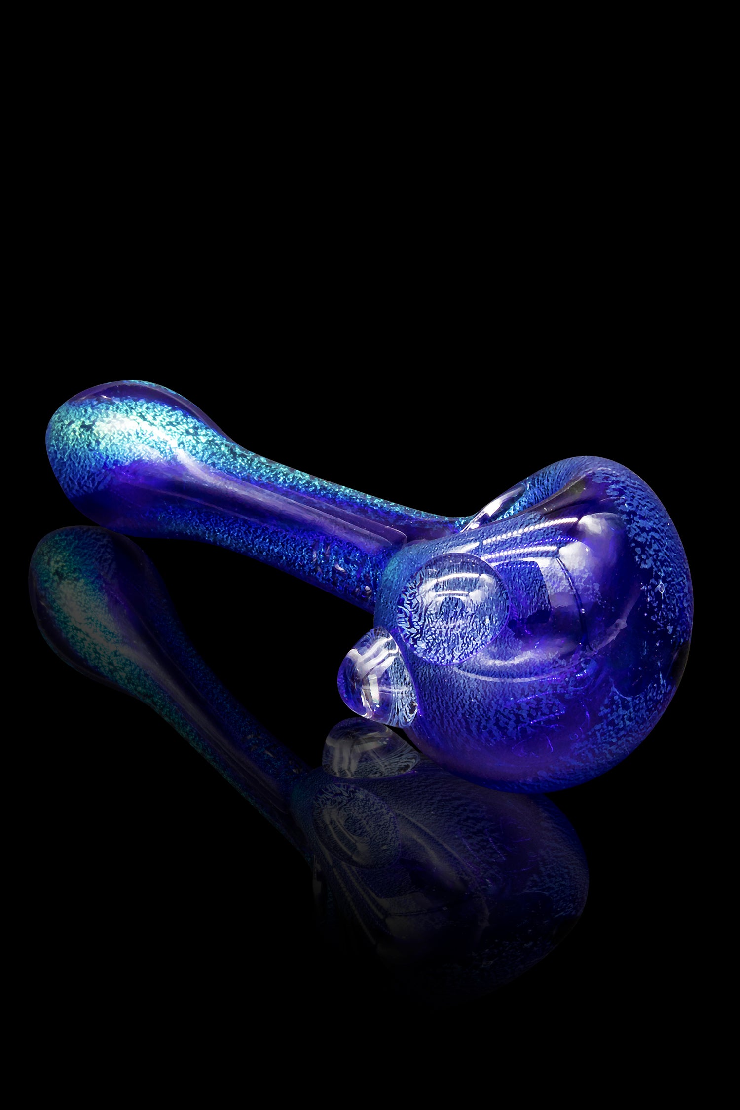 Blue glass cannabis pipe with iridescent sheen, reflecting on a dark surface.