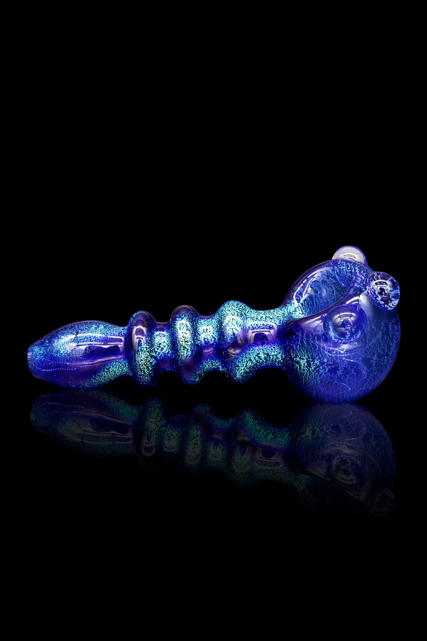Blue glass pipe with swirling iridescent patterns, reflecting on a dark surface.