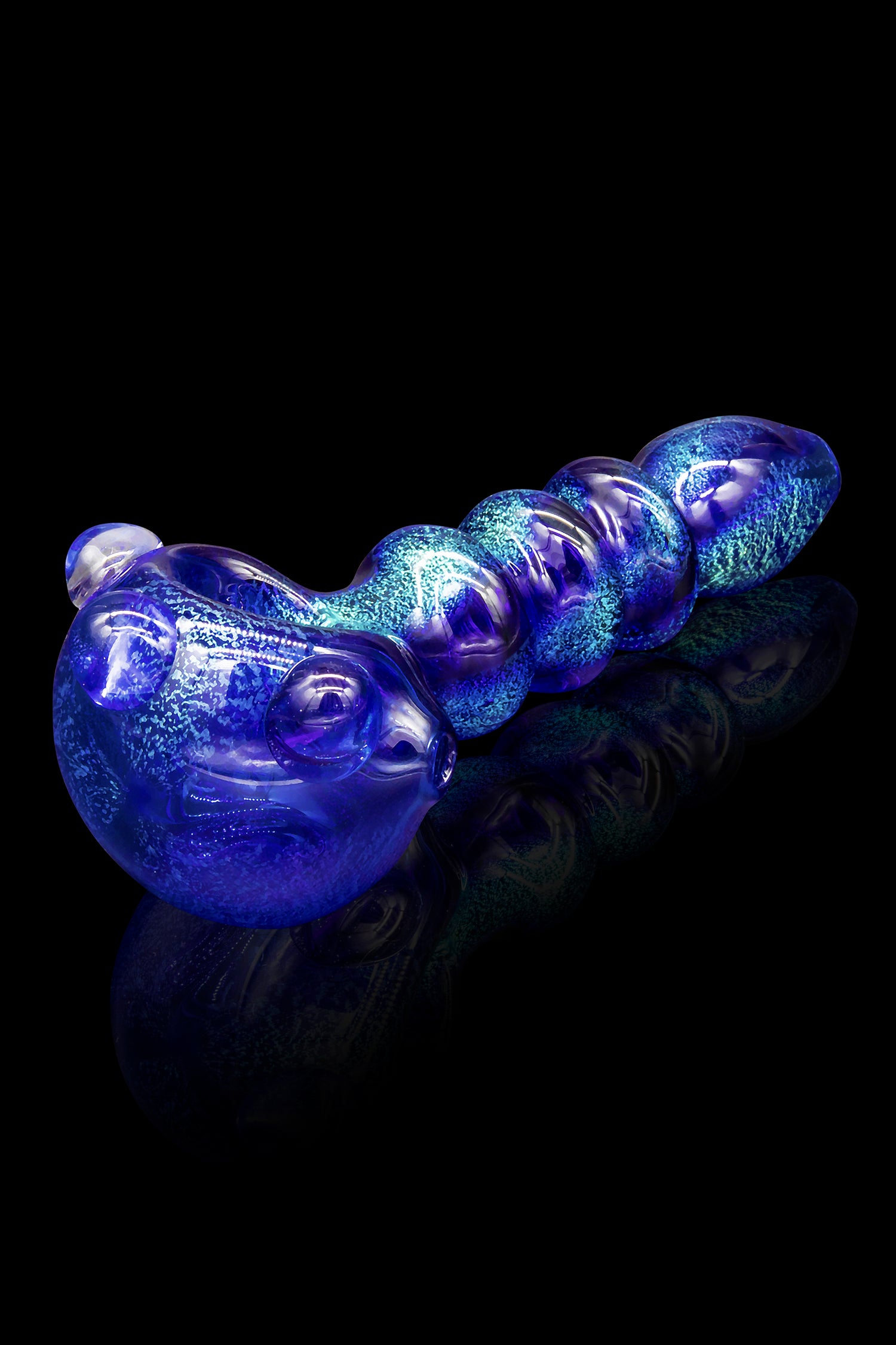 Blue glass cannabis pipe with speckled pattern on a reflective surface.