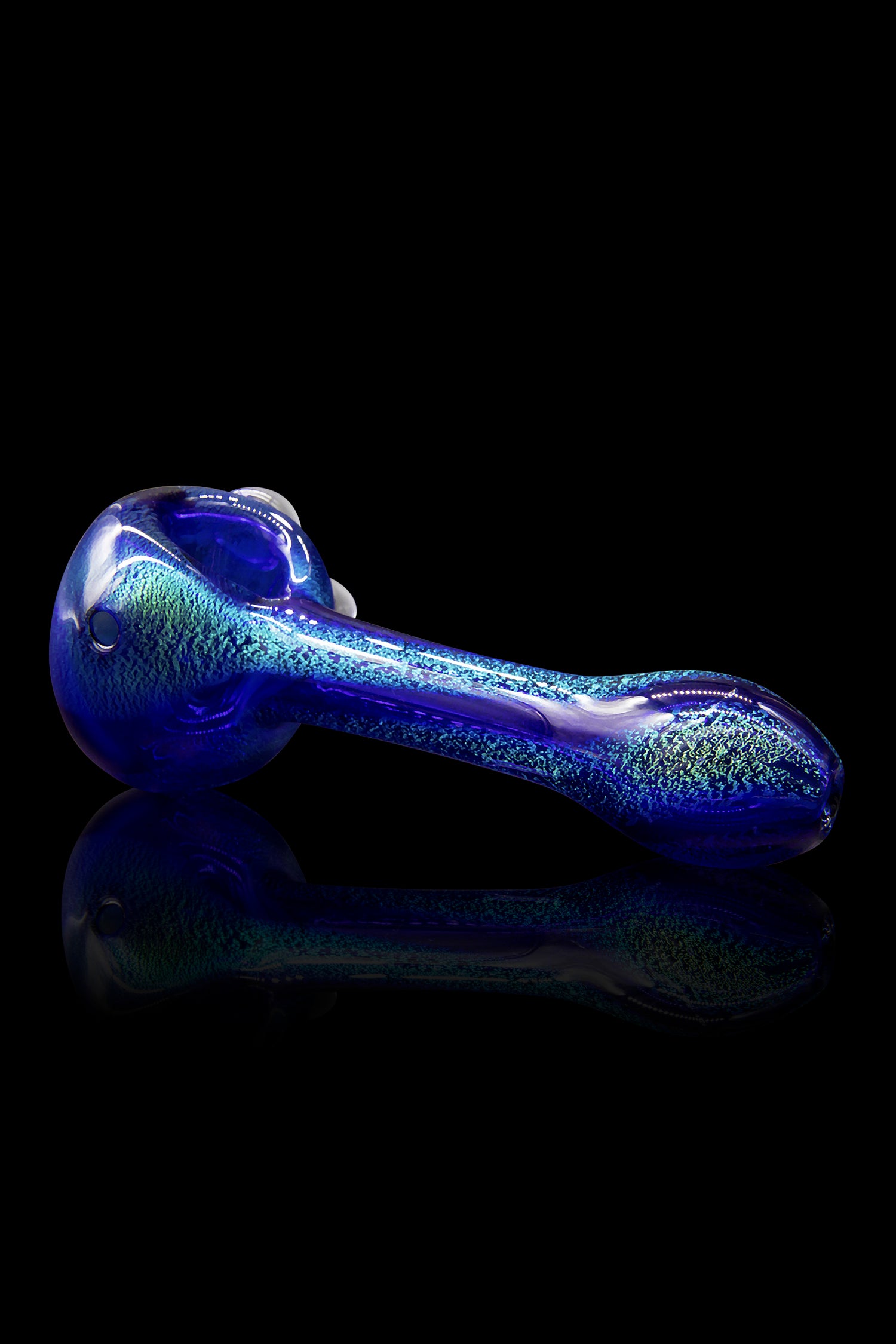 Blue glass pipe with glitter flecks, reflecting on a dark surface.