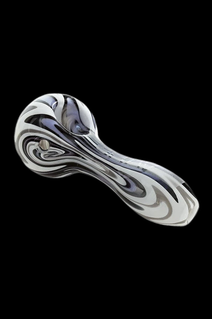 Glass pipe with black and white swirling pattern.
