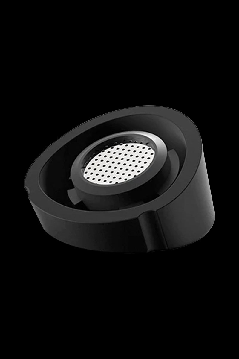 A close-up, angled view of the Pro Vaporizer, showcasing its circular design and dark, matte finish.