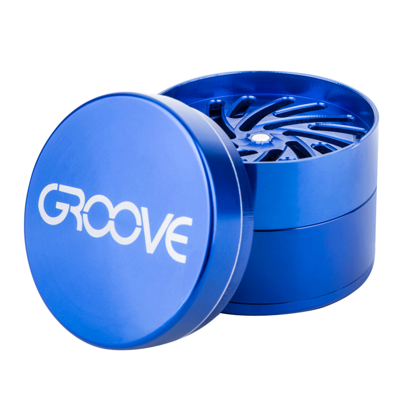 An opened Aerospaced Groove 4-Piece Aluminum Grinder, displaying its multi-tiered interior from a slightly angled front view.