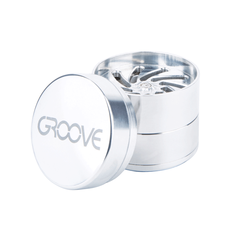 A close-up, angled view of the Aerospaced Groove 4-Piece Aluminum Grinders, showcasing its metallic, multi-tiered design.