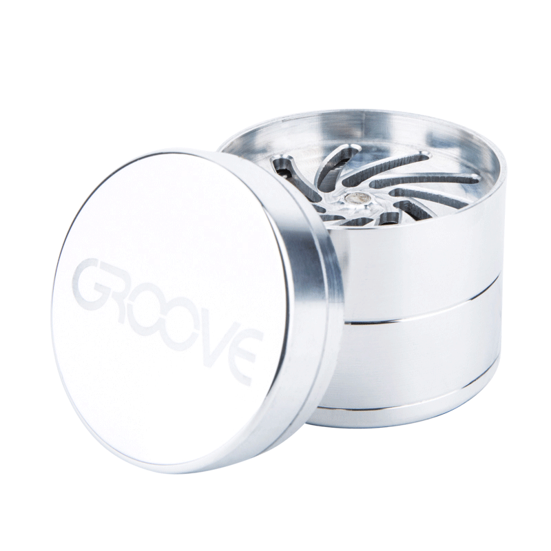 A close-up, angled view of the Aerospaced Groove 4-Piece Aluminum Grinders, showcasing its metallic, multi-tiered construction.
