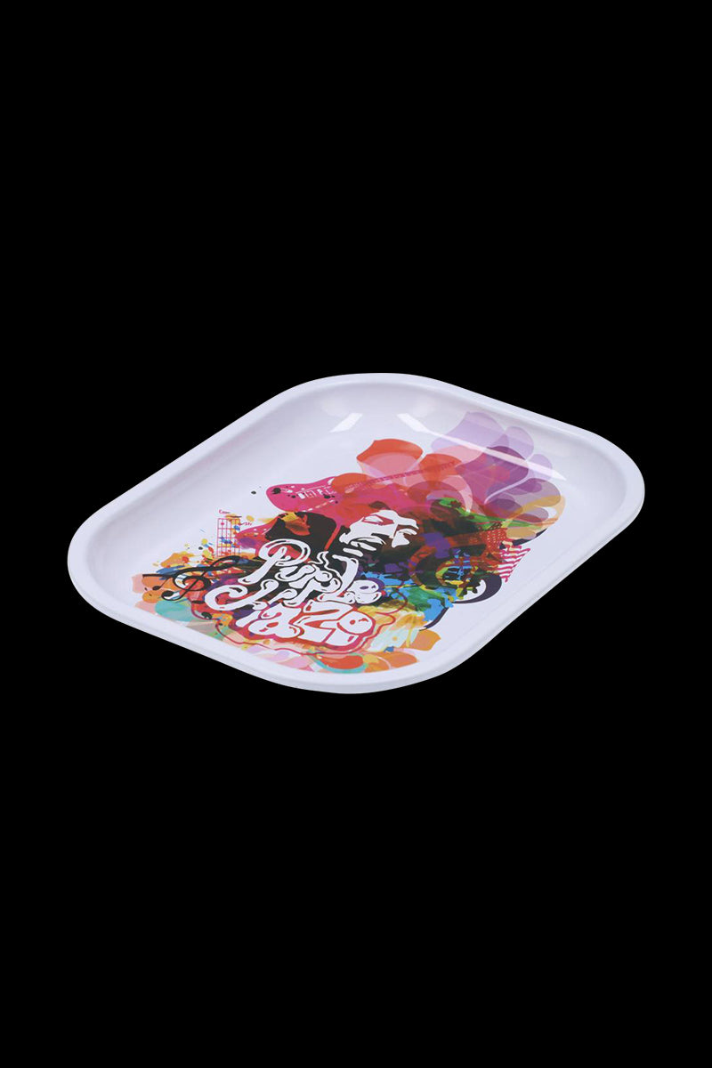 Angled view of the Famous Brandz Rolling Tray - Jimi Rainbow Haze showing a white tray with a colorful, layered portrait and abstract rainbow shapes on a black background