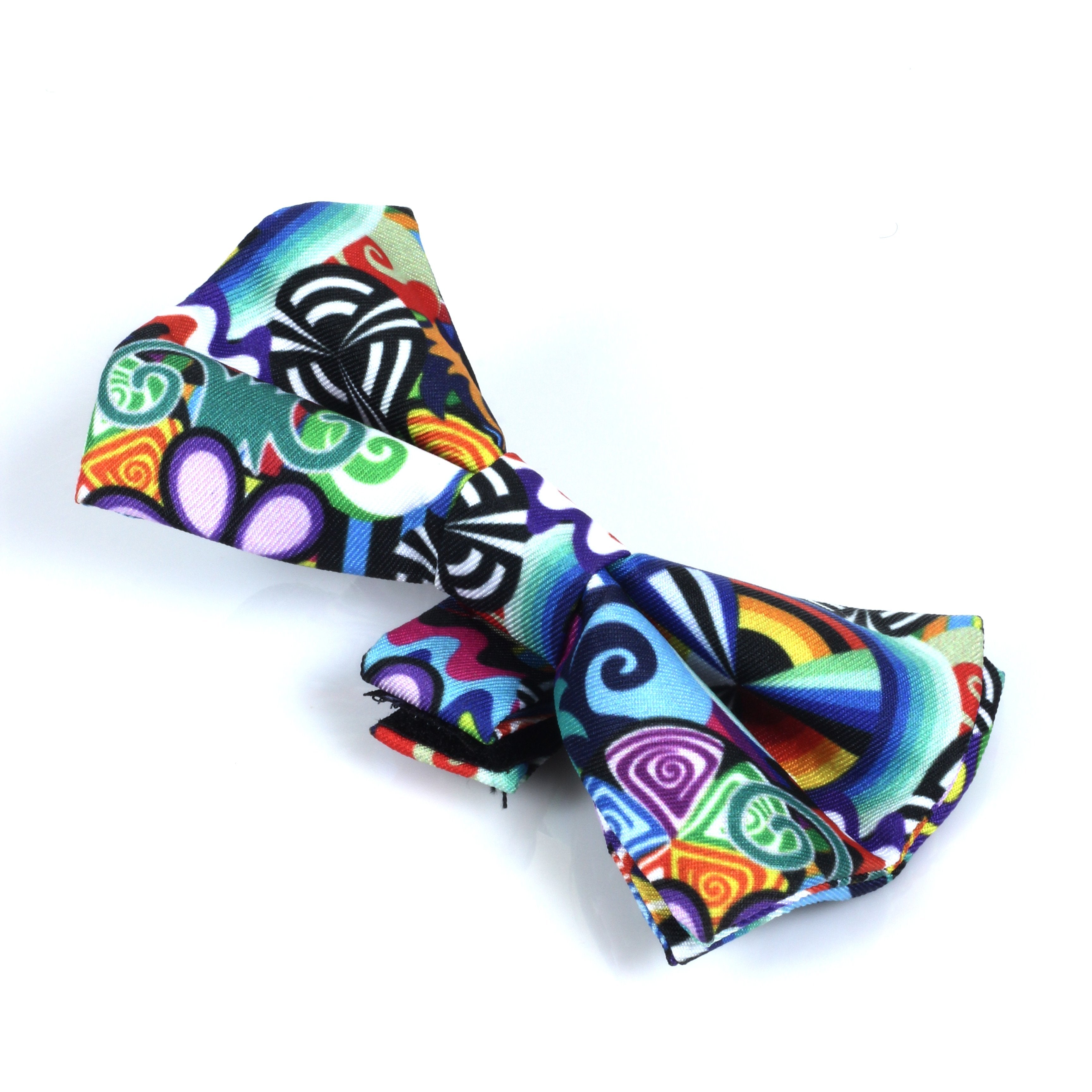 Close-up of a folded HeadyPet Bow Tie showing a colorful chevron-like swirl pattern against a white background.