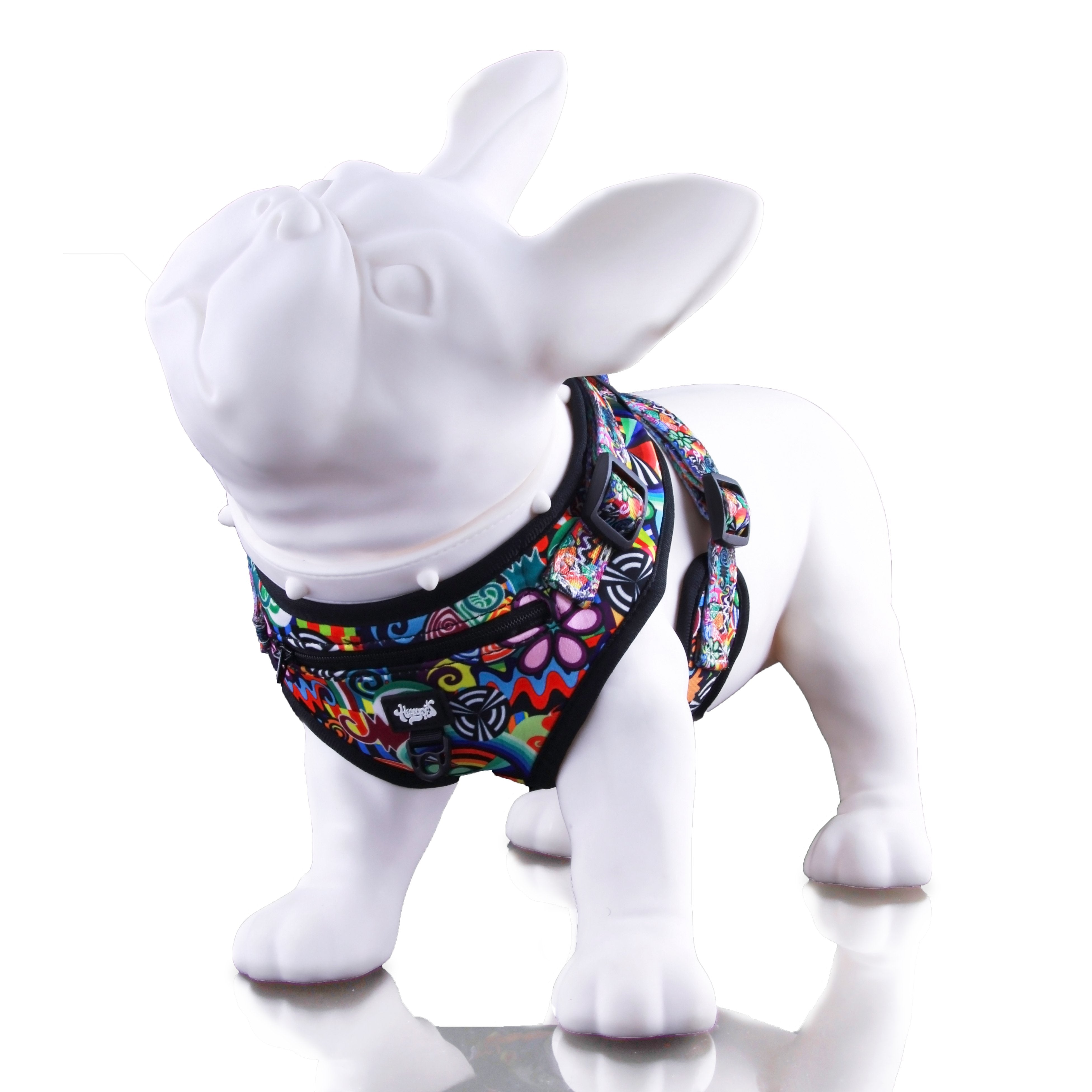 Front-angle studio shot of a white mannequin dog wearing a colorful HeadyPet Dog Harness that wraps around the chest and shoulders.