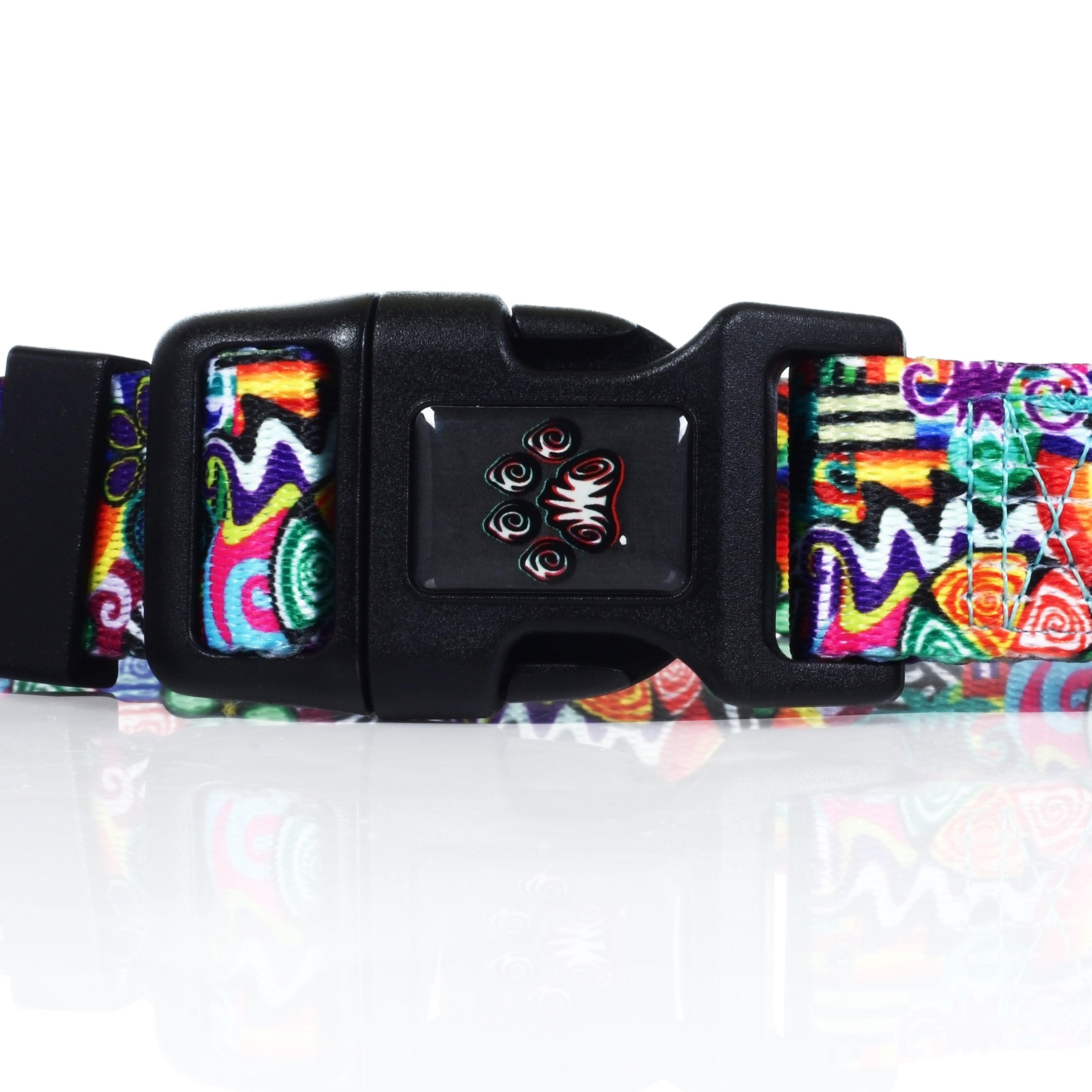 A close-up, angled view of the HeadyPet OG Collar, showcasing its patterned fabric and black plastic buckle.