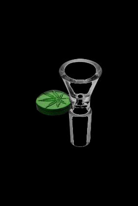 Glass pipe and cannabis bud on black background.