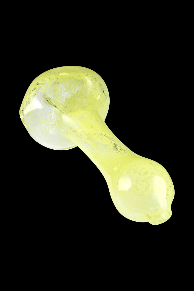 Angled close-up of the Glassheads Spoon Pipe with Scatter Frit showing its pale yellow glass and speckled frit against black background