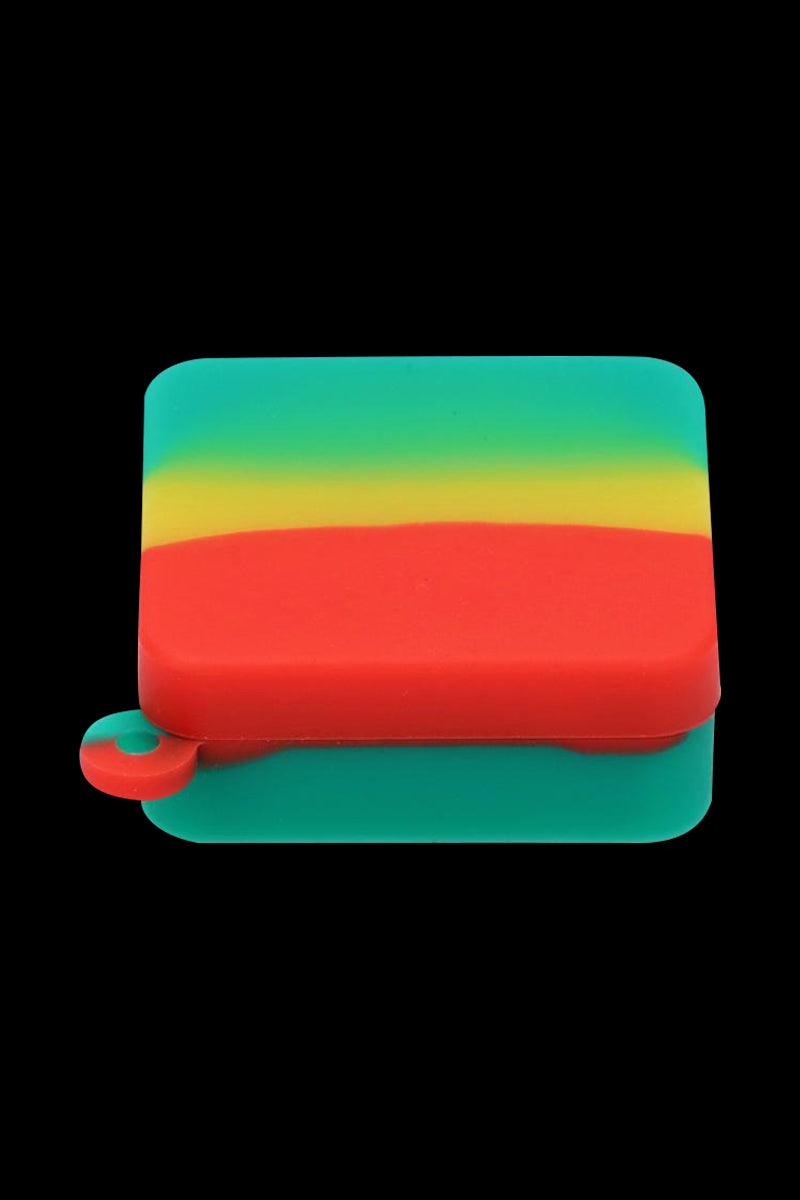 Close-up front view of the Silicone Square Keychain Stash Container showing a yellow-green-red layered silicone square against a black background.