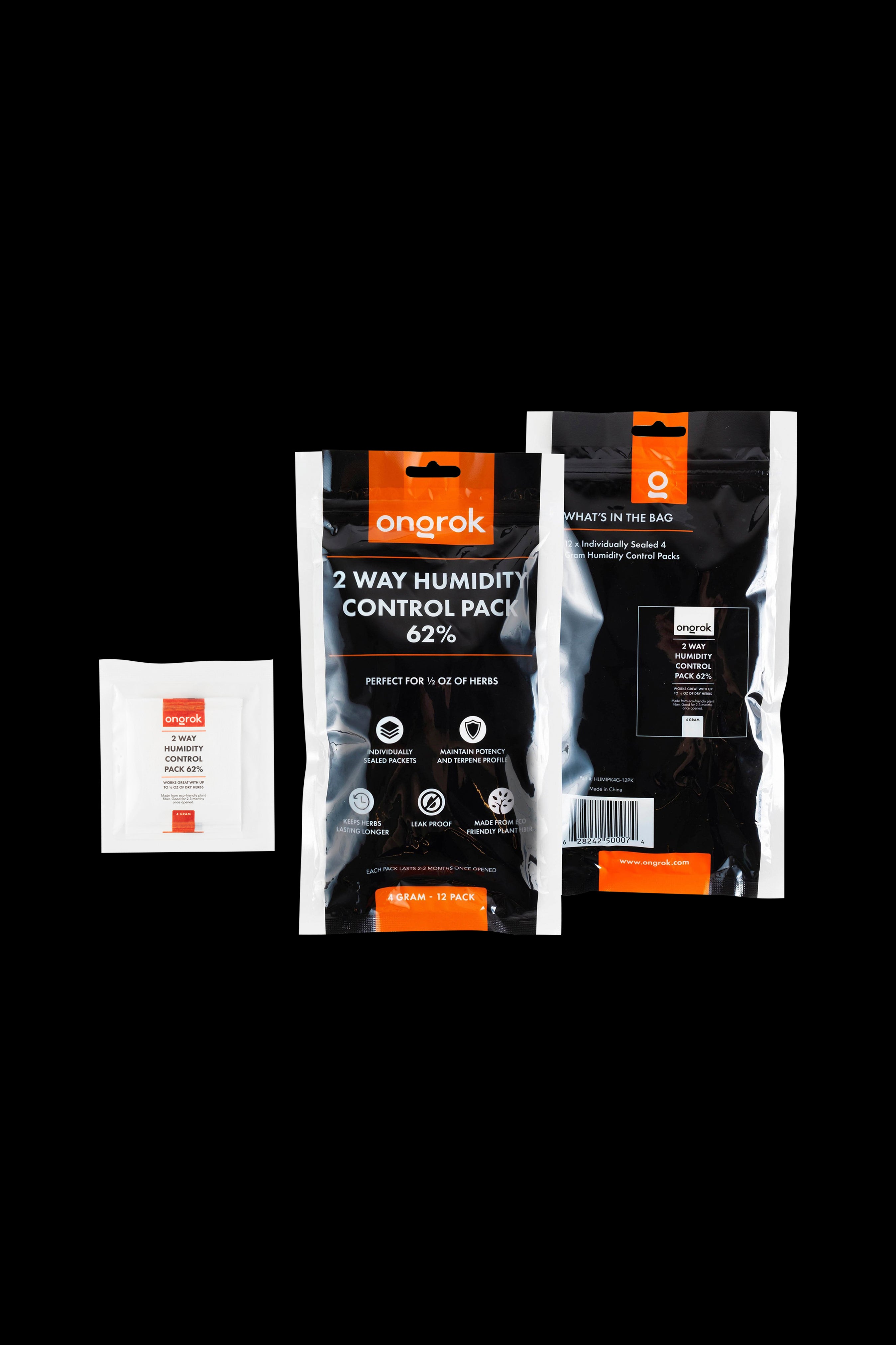 Three black and orange Onopak humidity control packs for preserving cannabis, shown against a dark background.