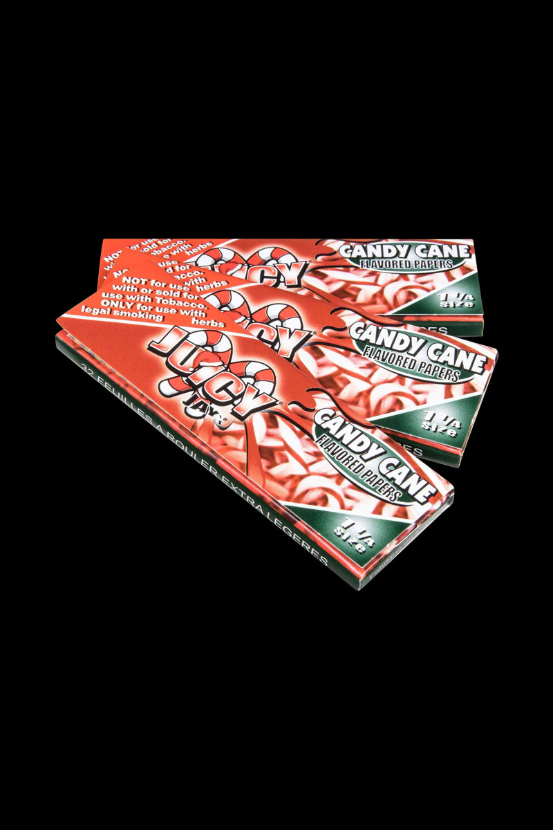 A close-up shot of a pack of Juicy Jay's Classic Size Flavored Rolling Papers, angled slightly to reveal the colorful branding and text.