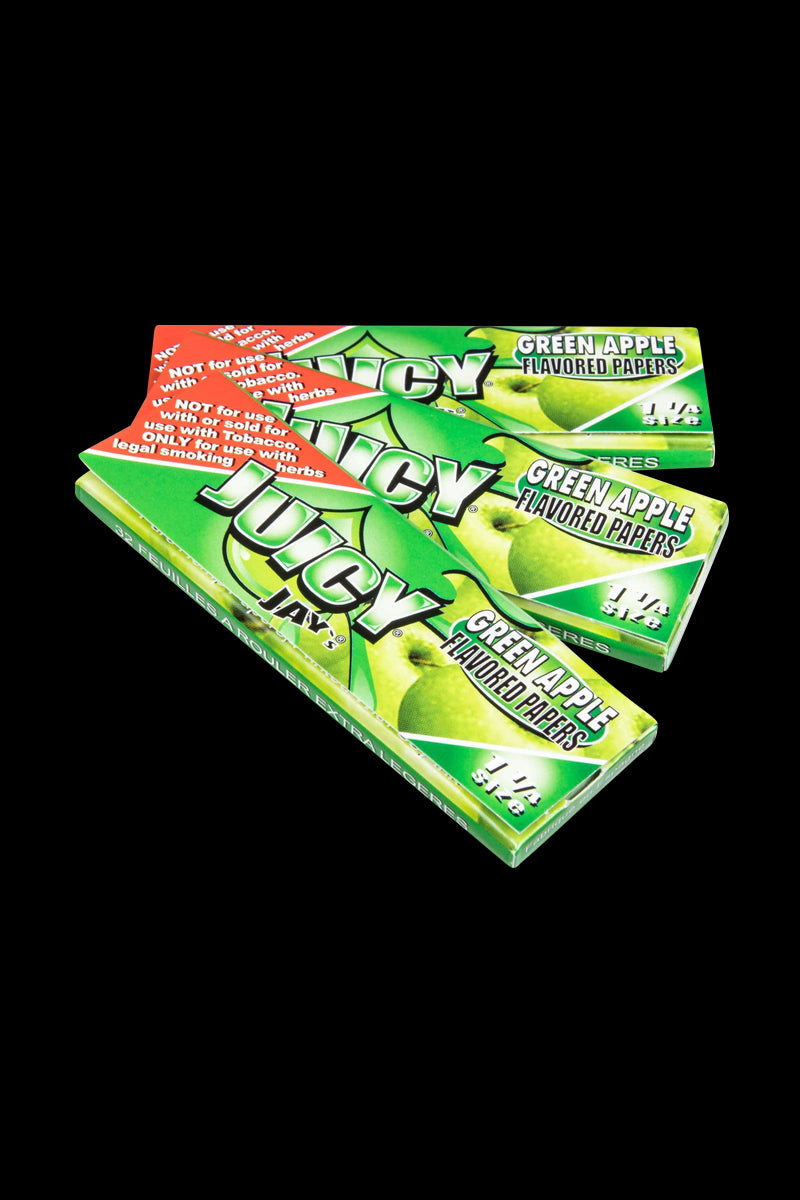 Classic 1-1/4" Size Flavored Rolling Papers package angled on a dark surface, displaying colorful branding and text.