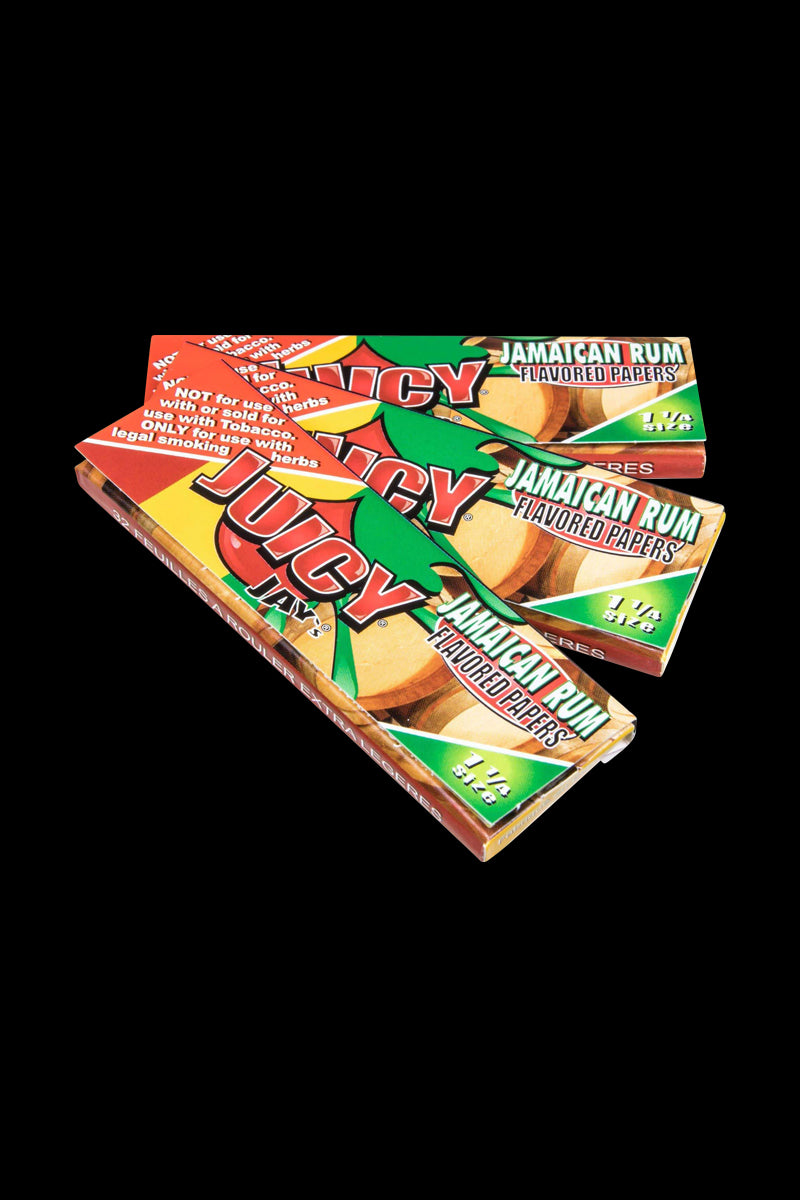 Close-up of Classic 1-1/4" Size Flavored Rolling Papers with bright colors and text on a black background.