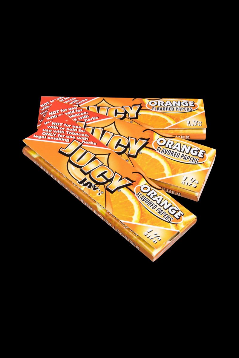 A close-up of Juicy Jay's Classic Size Flavored Rolling Papers package with orange coloring angled towards the viewer.