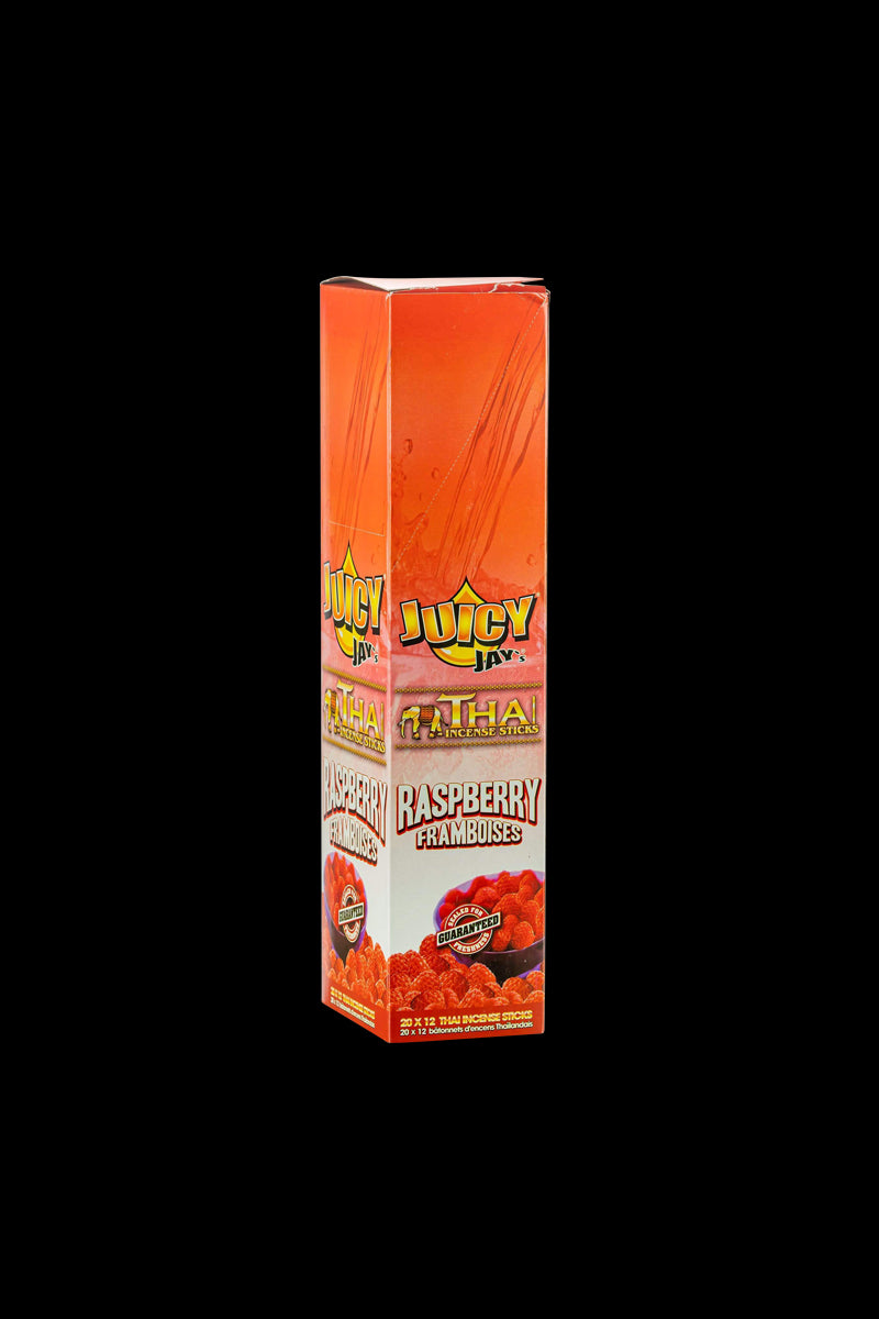 A close-up, front view of the Thai Incense Sticks packaging, featuring bold lettering and vibrant colors against a black background.