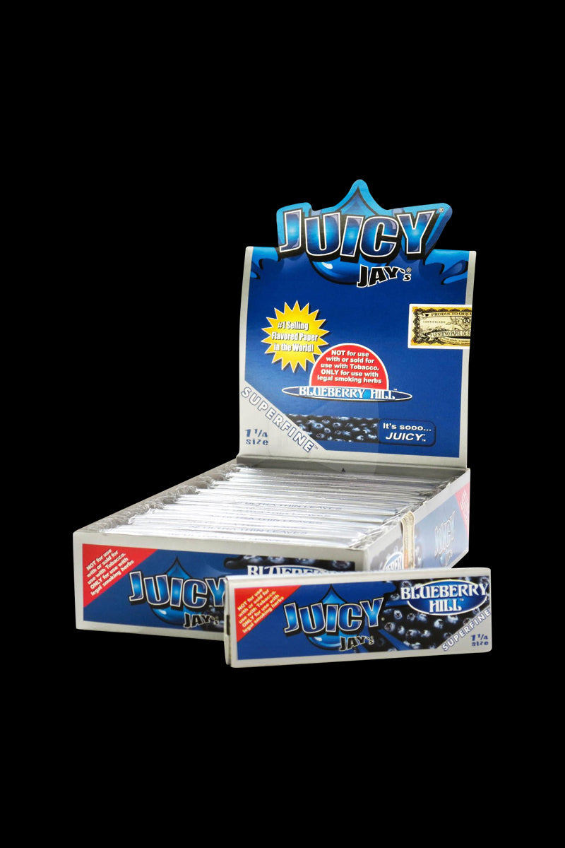 A close-up, angled view of Juicy Jay’s Super Fine Blueberry Rolling Papers package against a black background.