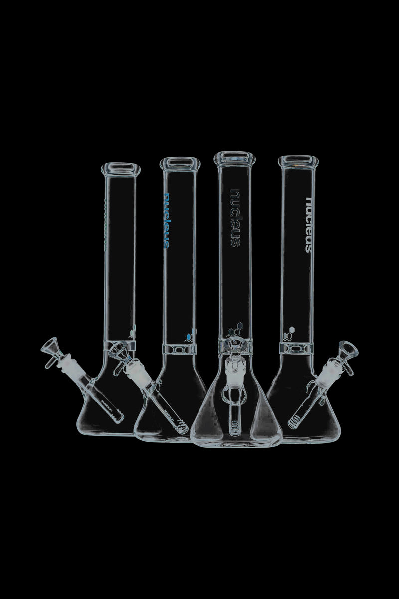 A front view of the Nucleus 12" Beaker Bong with Donut Style Ice Catcher, showing a clear glass piece against a black backdrop.