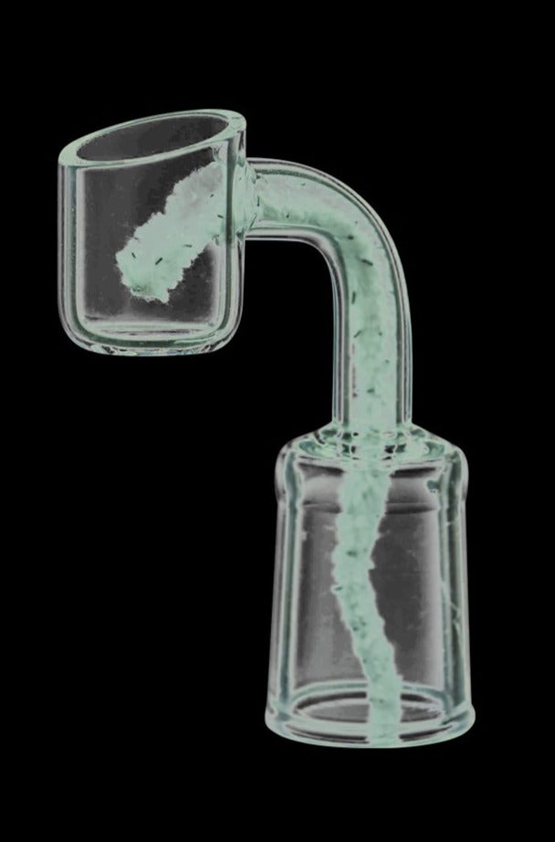 A close-up view of Nucleus Barbed Pipe Cleaners, appearing as thin, curled strands against a dark background.