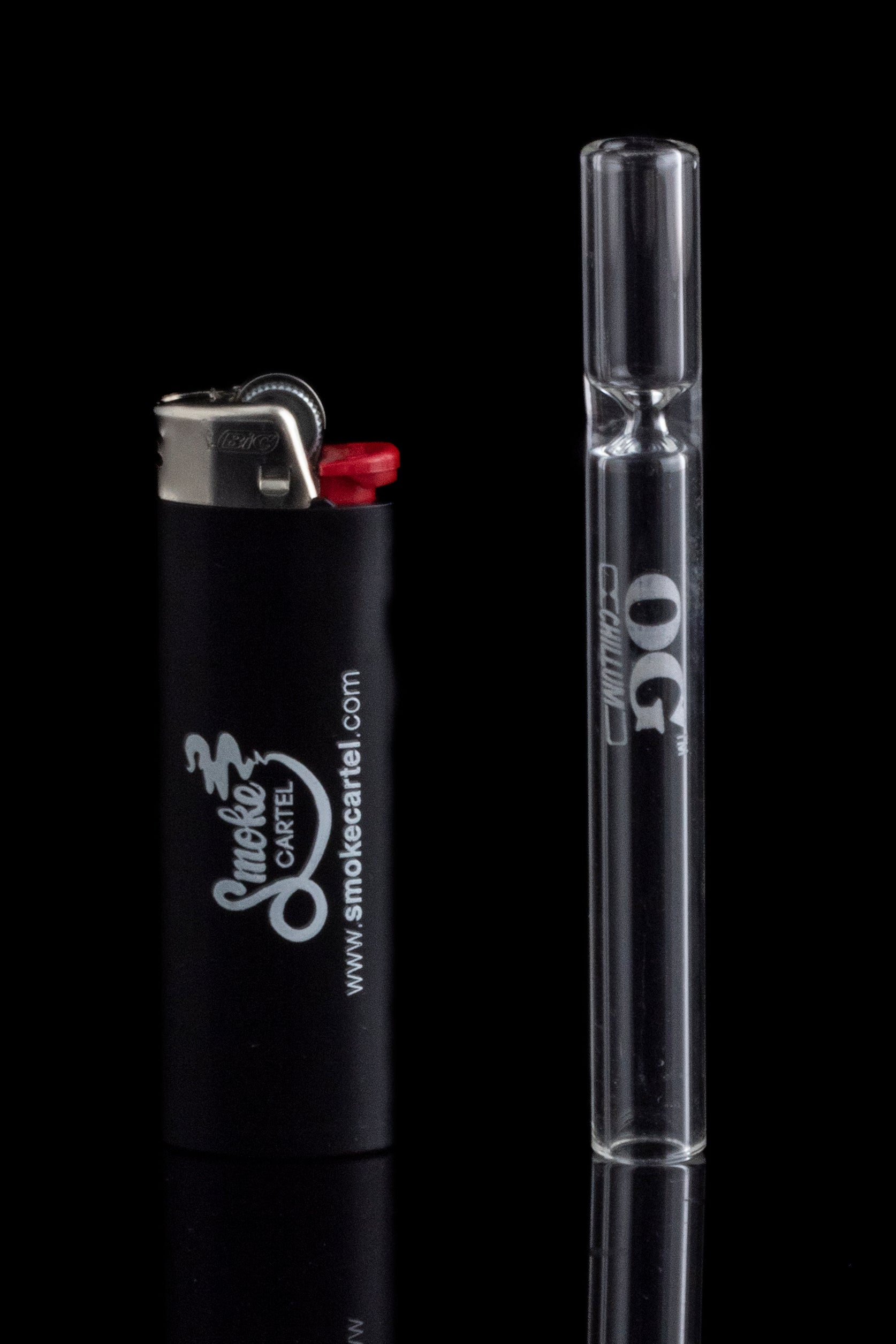 Glass pipe and lighter with branding for Smoke Cartel, reflecting on a black surface.