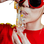 Close-up, front view of the Orbit Mini Rig 4-Piece Kit held in a hand, showcasing its compact size and clear glass construction.