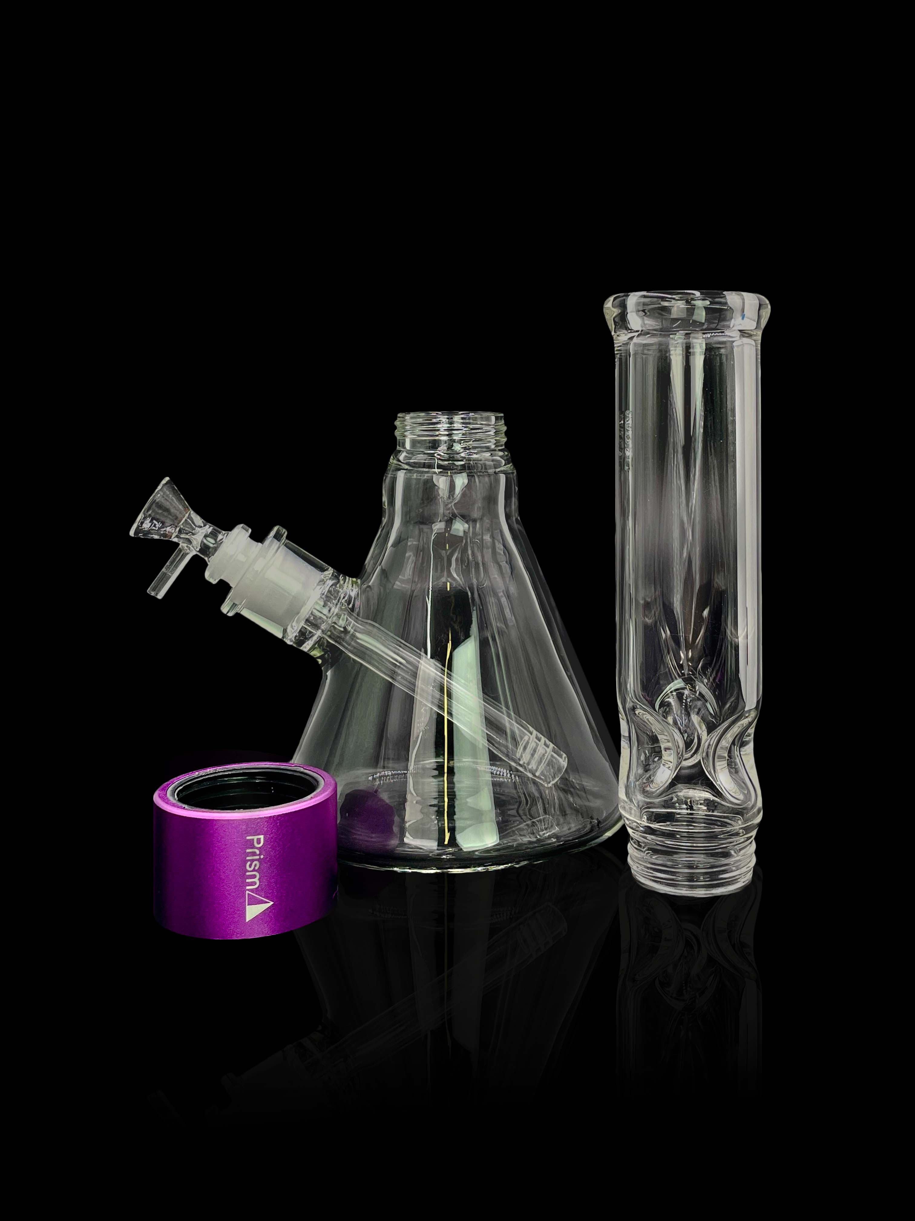 The Prism Water Pipes Starter Kit is displayed in a side view against a dark backdrop, highlighting its clear glass construction.