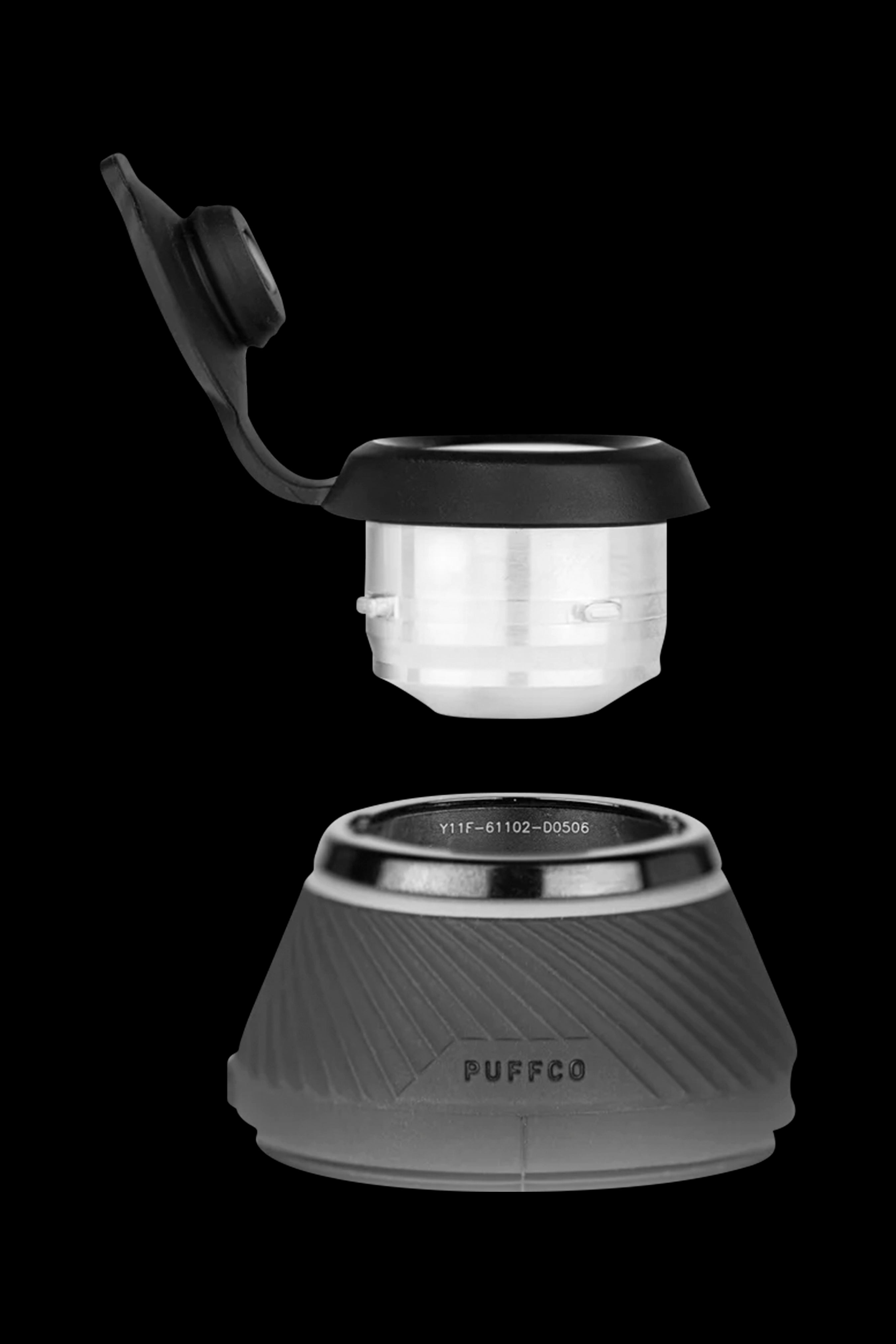 Puffco Peak portable dab rig with glass atomizers separated from the base.