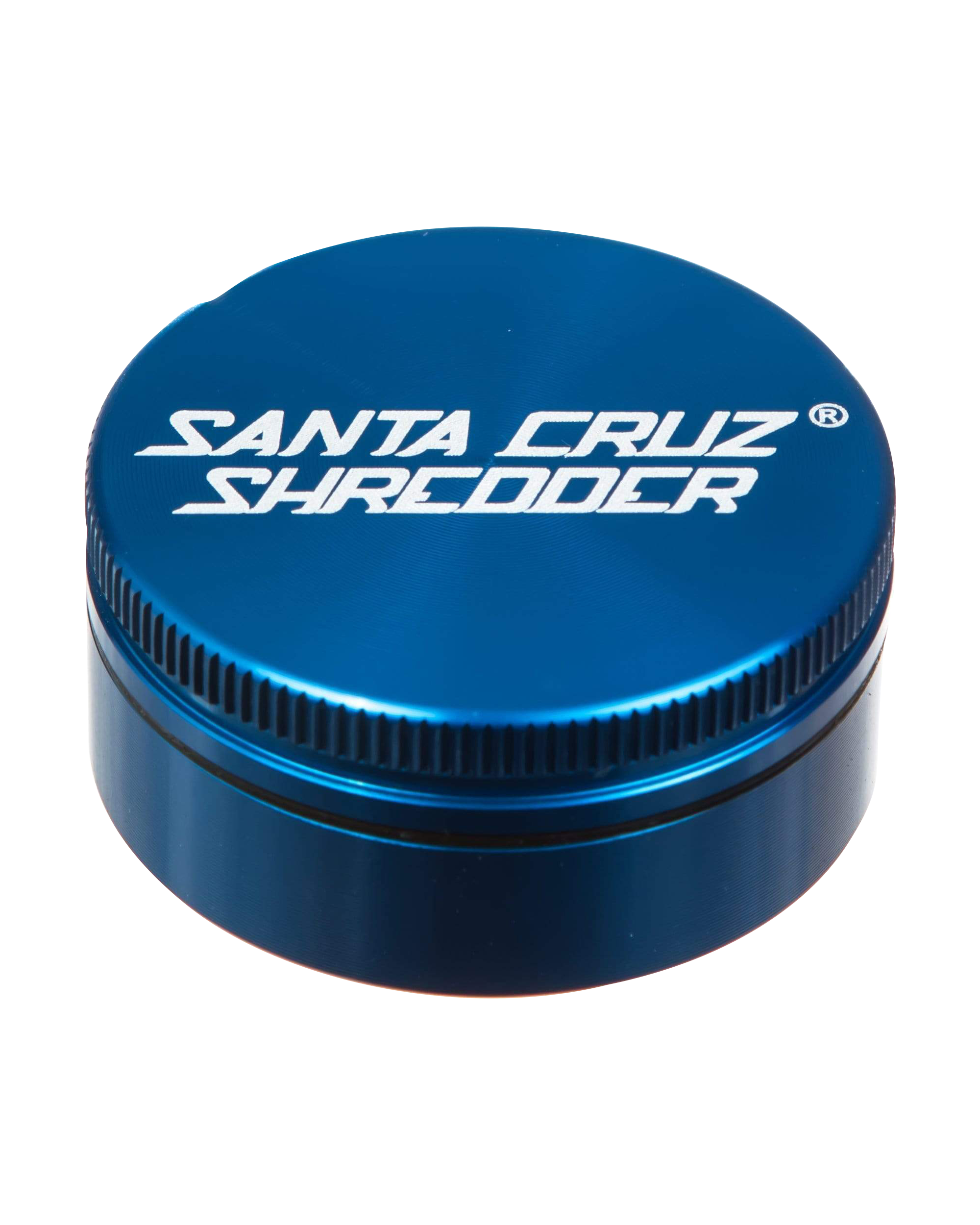 Close-up of the Santa Cruz Shredder Small 2-Piece Grinder, showing its metallic blue, ridged top from a slightly above angle.