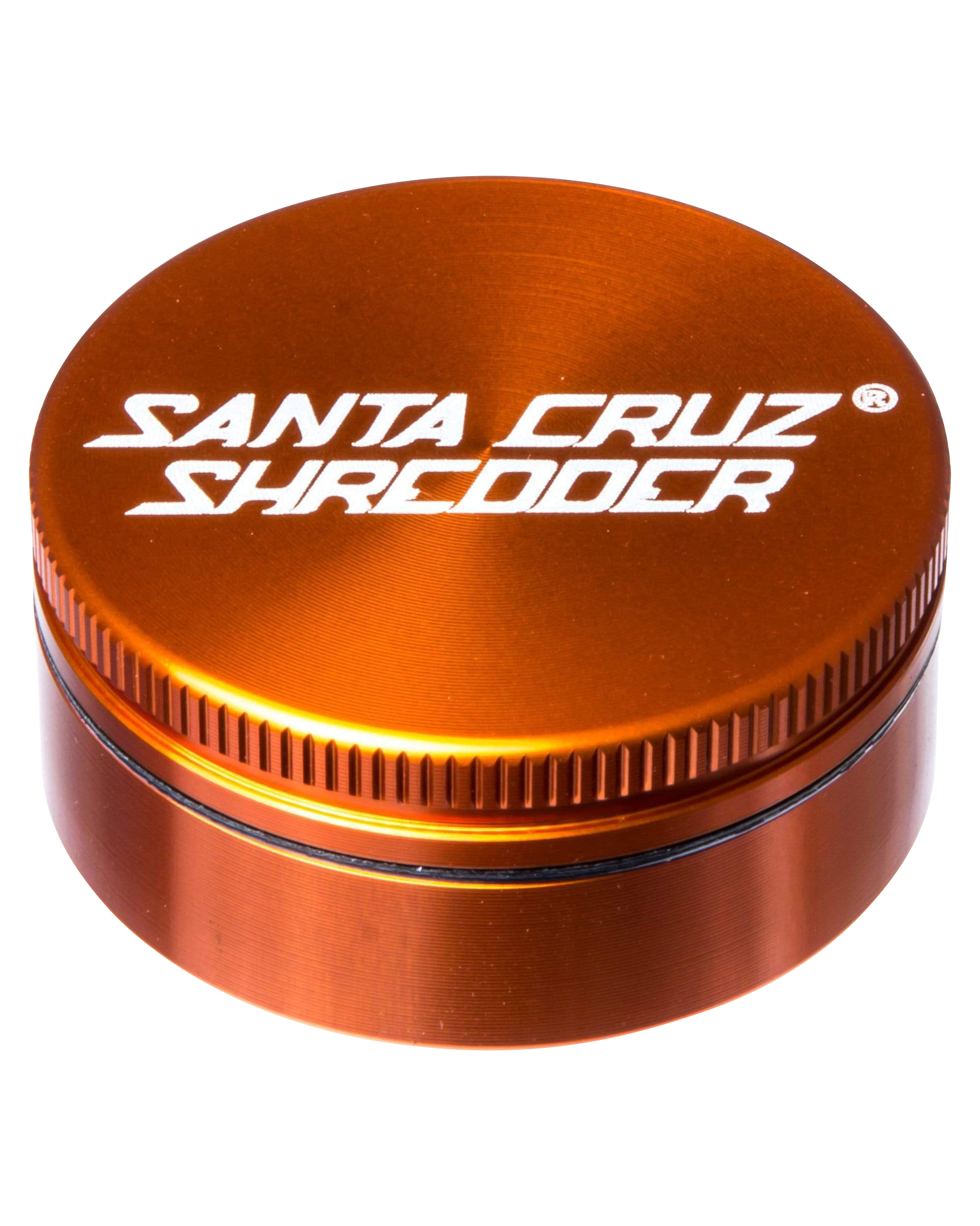 A close-up, angled view of the Santa Cruz Shredder Small 2-Piece Grinder, showcasing its metallic, ridged construction.