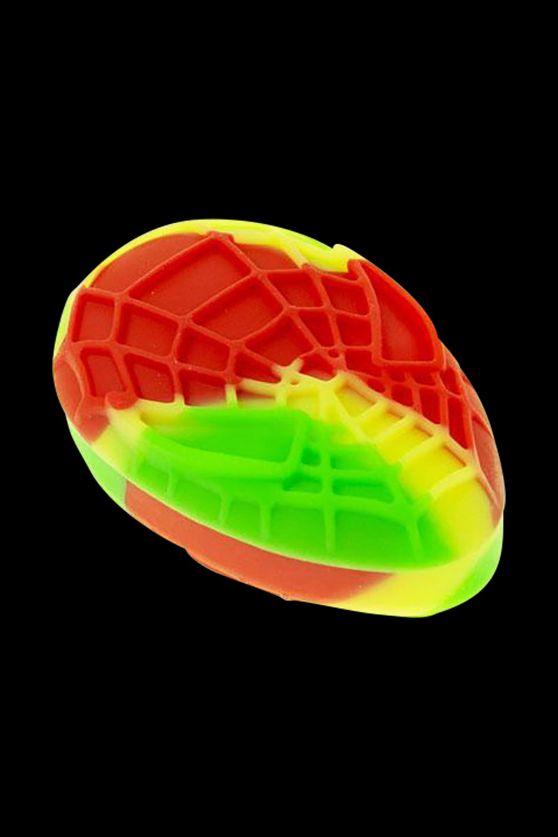 Angled close-up of a pink blue Silicone Non-Stick Teardrop Stash Container showing multicolored red, yellow, and green silicone textures against a black background