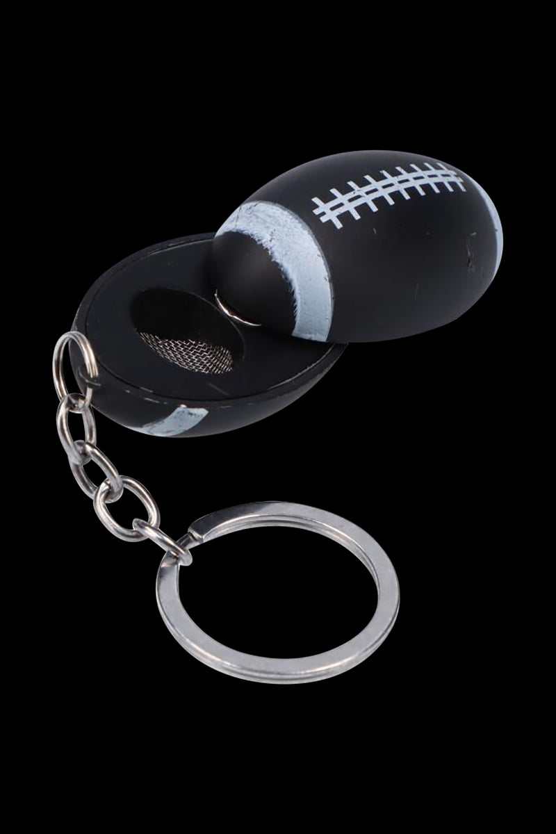 Close-up of the American Football Metal Hand Pipe with Key Chain opened to show its black football-shaped bowl, mesh screen, and silver key ring.