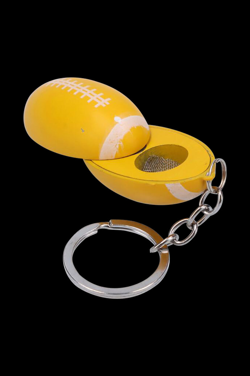 Close-up of the American Football Metal Hand Pipe with Key Chain opened to show its yellow football-shaped metal shell and attached silver key ring.