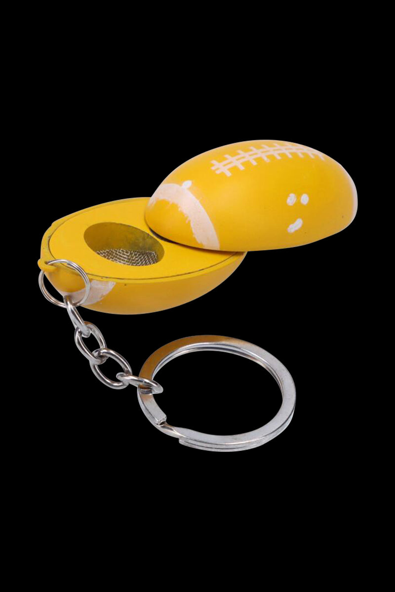 Close-up of the American Football Metal Hand Pipe with Key Chain in yellow, opened to show its metal screen and attached silver key ring