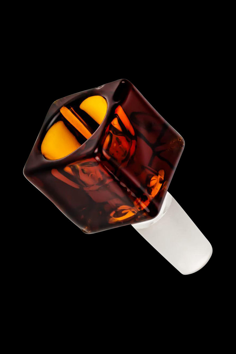 Angled close-up of the Square Glass Bowl in clear glass showing a dark amber, faceted square bowl with a bright yellow interior against a black background