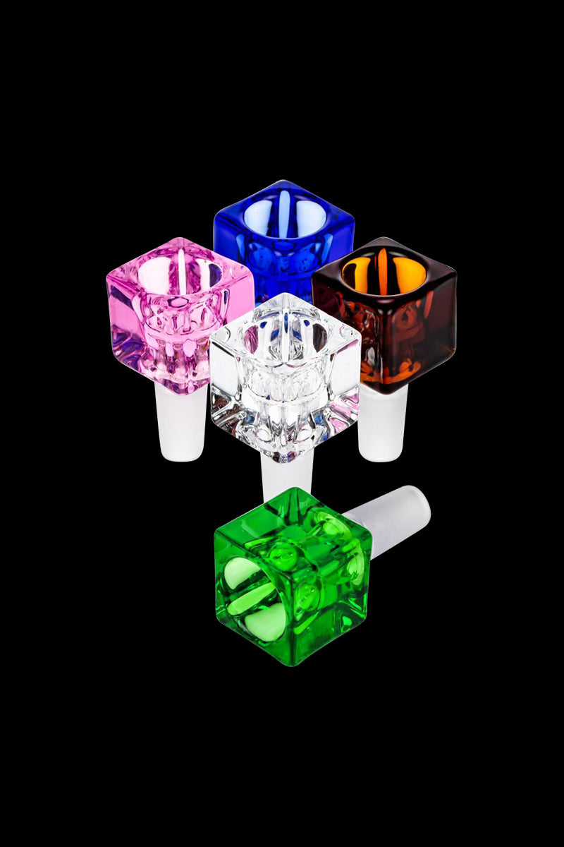 Top-down view of five colorful Square Glass Bowl pieces—blue, pink, amber, clear, and green—arranged in a loose cluster on a black background.