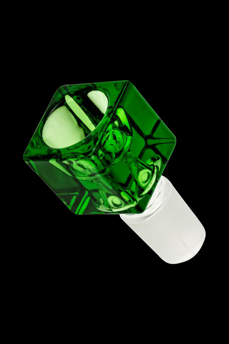 Angled close-up of a green Square Glass Bowl resting on a white stem against a black background.